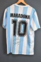 DIEGO MARADONA; a signed 1986 retro-style Argentina football shirt, signed to the reverse, size L.