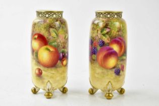 HARRY AYRTON FOR ROYAL WORCESTER; a pair of cylindrical vases with reticulated rims on four