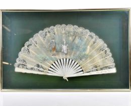 An early 20th century 19th hand painted fan, decorated with a gentleman and lady within landscape