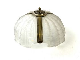 An Art Deco frosted glass and chrome shell shaped ceiling light.