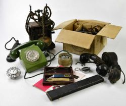 A vintage wooden telephone, with a green bakelite telephone, telephone accessories, and a boxed