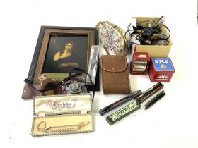 An assortment of collectors' items to include a Victorian style print on glass portrait, Canon EOS