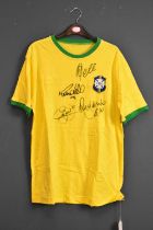 BRAZIL; a 1970s retro-style football shirt signed to front by Pele, Ronaldo, Neymar, Ronaldinho.