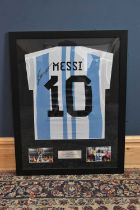 LIONEL MESSI; a signed Argentina football shirt, 67 x 87cm, framed and glazed. Condition Report: