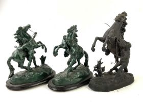 A pair of green painted spelter figures of Marly horses on wooden plinth bases, height 32cm, and a