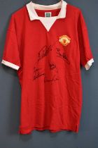 MANCHESTER UNITED; a 1970s retro-style football shirt, signed by Ronaldo, Robson, Scholes, Cantona