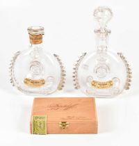 BACCARAT; two empty Remy Martin glass cognac bottles with labels and stoppers, and a cased set of