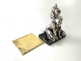 † LA ESFINGE; a silvered figure on marble base, 'Sphinx der Pilar Francesch', signed to the left