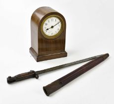 A WWI Lee Enfield bayonet with scabbard and an Edwardian mantel clock, the enamel dial set with