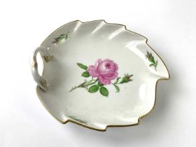 MEISSEN; a rose painted leaf shaped dish with painted and impressed marks to reverse, length 19cm.