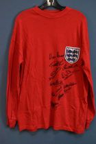 ENGLAND; a 1966 England retro-style football shirt, signed to the front by Hurst, Peters, Hunt, B.