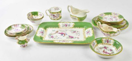 MINTON; a part tea and dinner service decorated with 'Asiatic Pheasants' inside a green border (