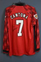 ERIC CANTONA; a 1996/98 Manchester United retro-style football shirt, signed to the reverse, size L.