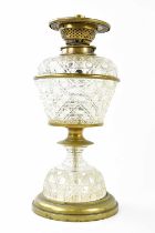 A Victorian hobnail cut clear glass and brass mounted oil lamp with detachable resevoir, height