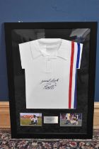 PELÉ (EDSON ARANTES DU NASCIMENTO); a framed 'Escape to Victory' retro-style football shirt,