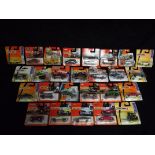 26 x Matchbox Carded Vehicles. Makers included Ford, Cadillac, Audi, Chevrolet and Jaguar. Models
