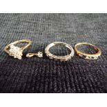 4 x 9ct Gold items one with a Diamond. 3 x Rings(one White Gold), various white and blue stones