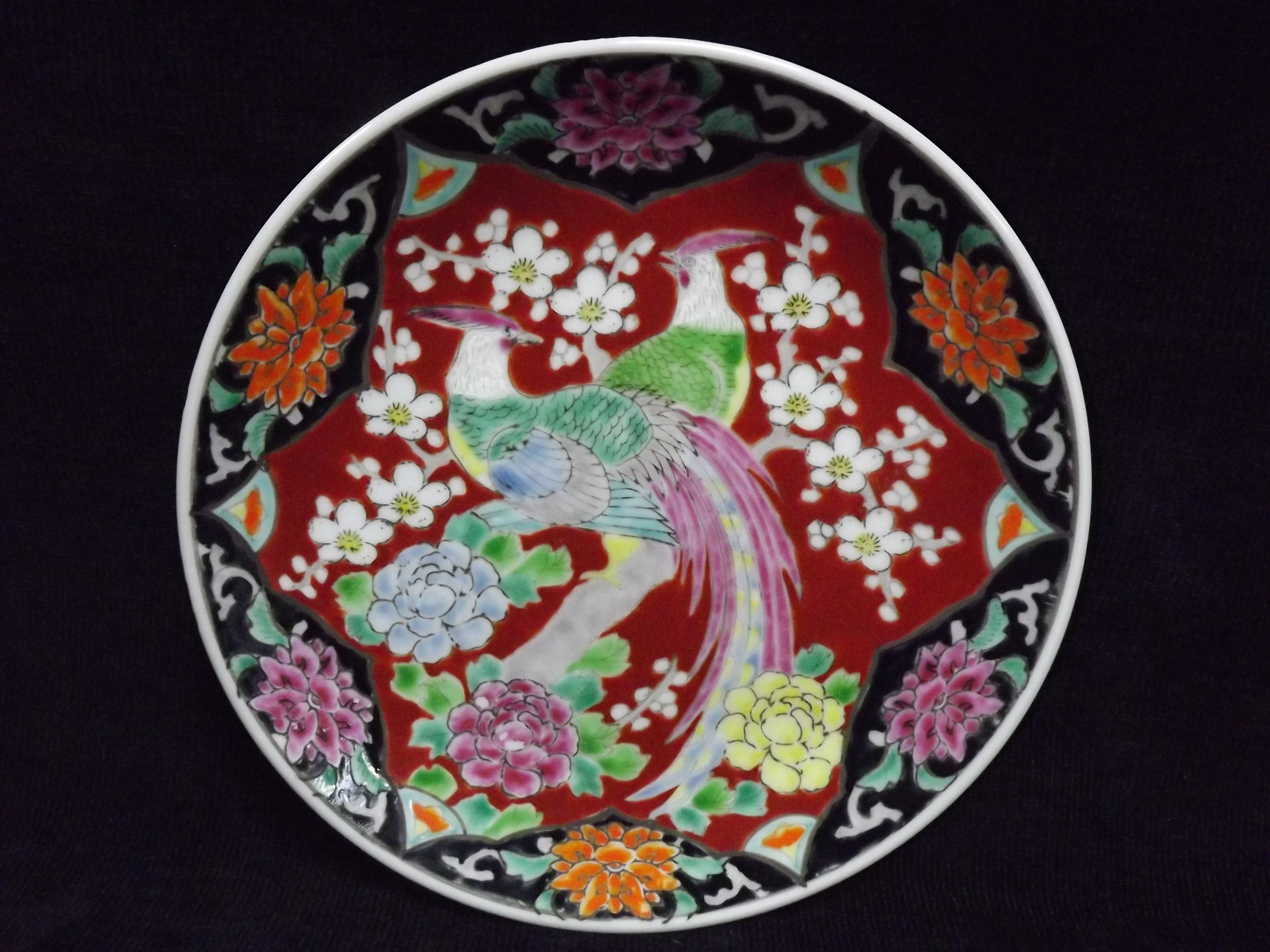 Chinese Famille Rose Plate. Enamel colours, 19th century heavy porcelain. Decorated with a pair of