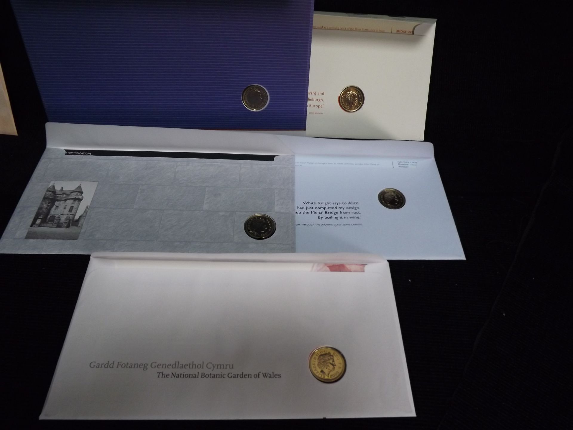 10 x GB Royal Mint Uncirculated £1 Coins Queen Elizabeth II in Royal Mail Stamp Sets. 2 x Welsh - Image 7 of 7