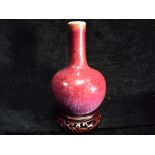 Small Chinese Flambe-Glazed Bottle Vase on later Rosewood stand. Pear-shaped bottle form