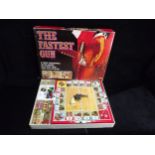 GB Denys Fisher 'The Fastest Gun' Western style Board Game and a U.S.A. Lone Star 'Firecat' metal