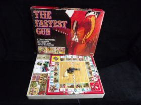 GB Denys Fisher 'The Fastest Gun' Western style Board Game and a U.S.A. Lone Star 'Firecat' metal