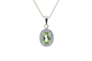 9ct Yellow Gold Diamond And Peridot Pendant (P 0.75) 0.11 Carats - Valued By IDI £1,405.00 - An oval