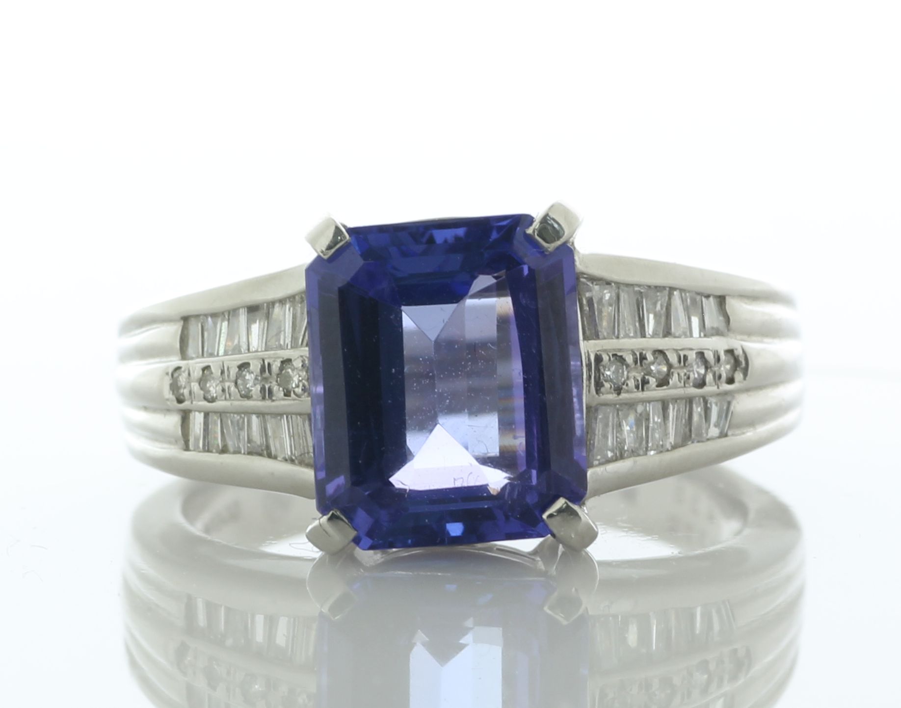 Platinum Single Stone Emerald Cut Tanzanite And Diamond Ring (T4.35) 0.37 Carats - Valued By IDI £