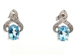 9ct White Gold Diamond And Blue Topaz Earrings - Valued By AGI £297.00 - A beautiful oval shaped