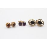 3 x 9ct gold paired gemstone stud earrings inc. amethyst, garnet & sapphire (2.5g)