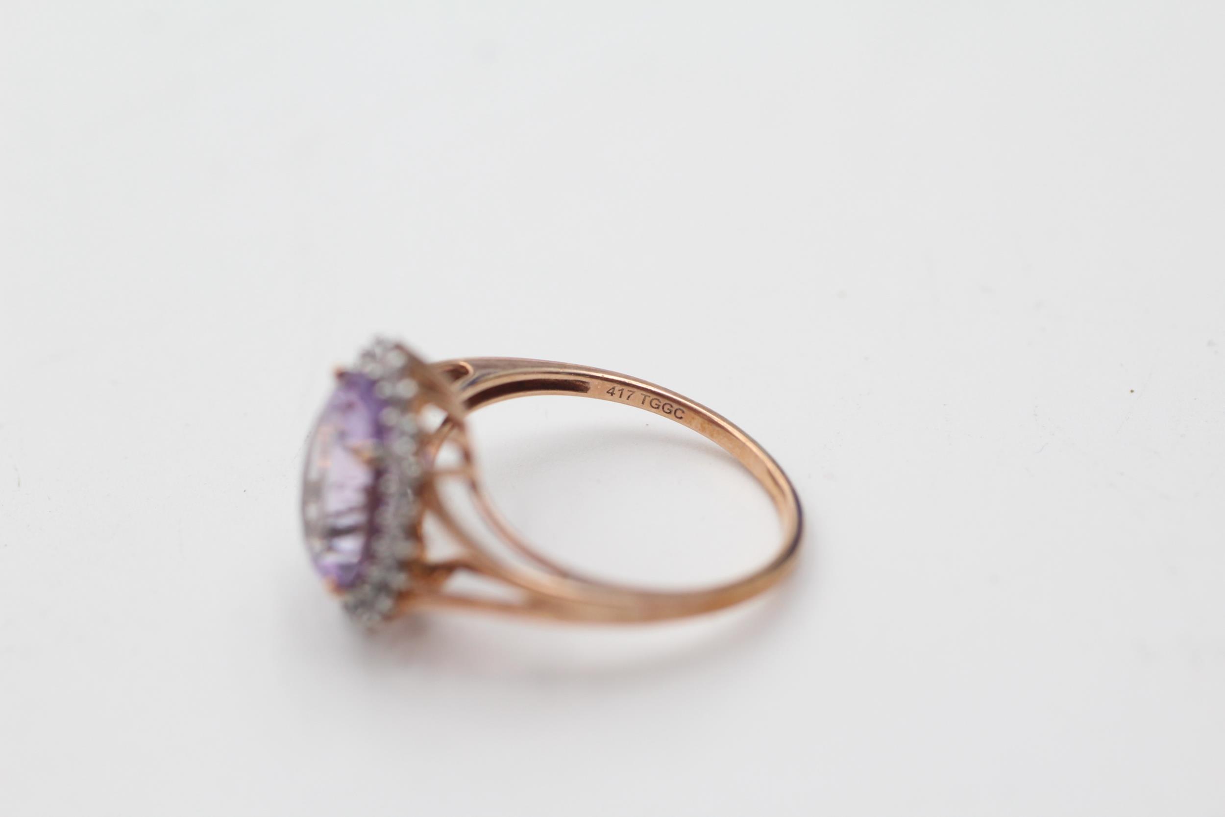 9ct gold amethyst and clear gemstone halo set dress ring (2.7g) size O - Image 5 of 5