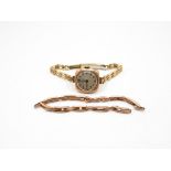 Ladies Reid and Co 9ct gold watch with replacement non gold strap but comes with original 9ct gold