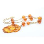 14ct gold amber necklace, as seen (23g)