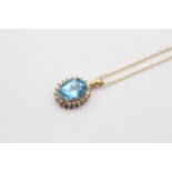 9ct Gold Topaz And White Gemstone Halo Pendant On Chain (2.4g)