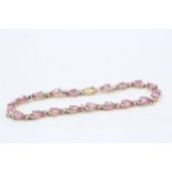 9ct gold diamond and synthetic pink sapphire set tennis bracelet (6.8g)