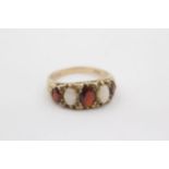9ct gold opal and garnet graduated five stone gypsy ring (3.3g) Size R