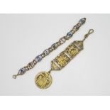 An Egyptian Revival Enamel Panel Bracelet And Decorative Fob