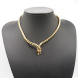 9ct gold snake necklace circa 1967 in a coiled pattern eyes set with diamonds 38 cm long 30.5g gross
