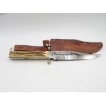 An original Bowie knife 11 inches long with sheath