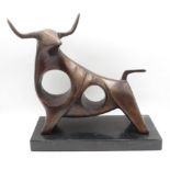 A cast bronze darli bull 10 inches long by 9 inches high on marble base 2.5kg in weight
