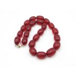 A Bakelite Bead Necklace With Screw Clasp For Restringing
