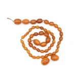 A Graduated Bakelite Bead Necklace For Restringing