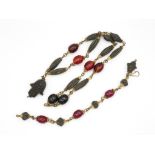 A Prayer Bead Necklace And Bracelet With Bakelite Beads