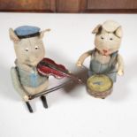 2x Schucco performing pigs, one with violin and one with drum - both running 4.5" high