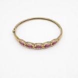 9ct gold, diamond and ruby bangle 11.7g