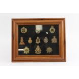 11 x Framed Military Cap Badges Inc Intelligence Corps, ATS, Etc // In vintage condition Signs of