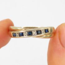 9ct gold diamond & sapphire crossover dress ring (2.9g) Size T 1/2