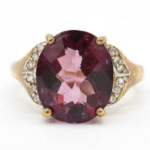 9ct gold coated purple topaz single stone ring with diamond sides (3.8g) Size N