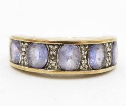 9ct gold tanzanite five stone ring with diamond spacers (3.5g) Size N 1/2