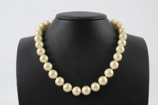 Faux pearl necklace by designer Christian Dior